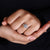 Oval diamond center stone with halo setting.
