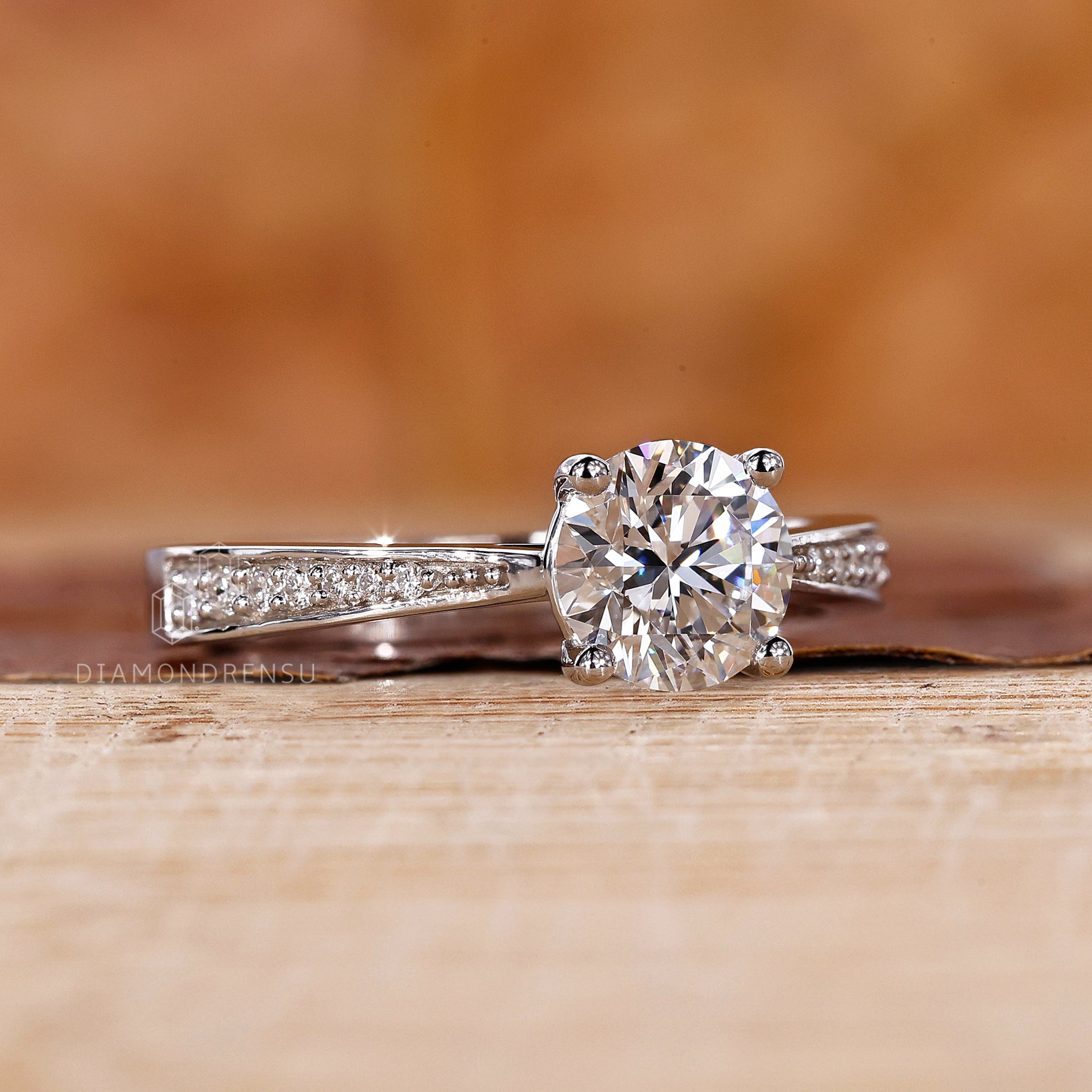 Tapered shank pave paired with round diamond engagement ring.
