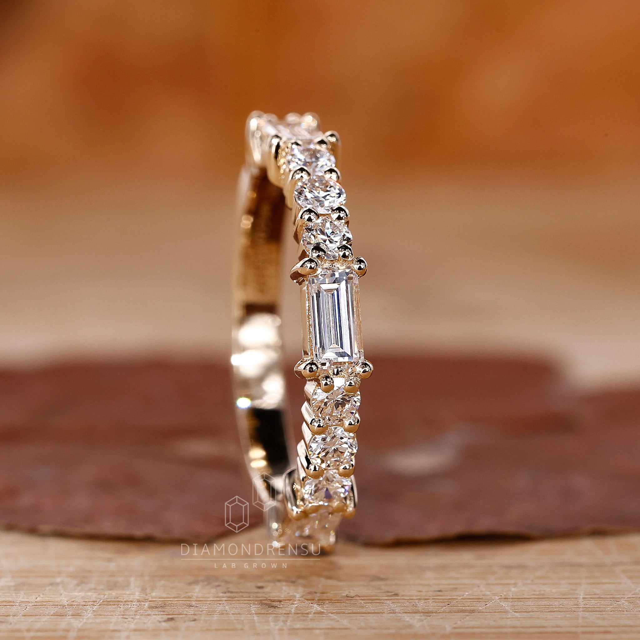 Yellow gold wedding band in prong setting

