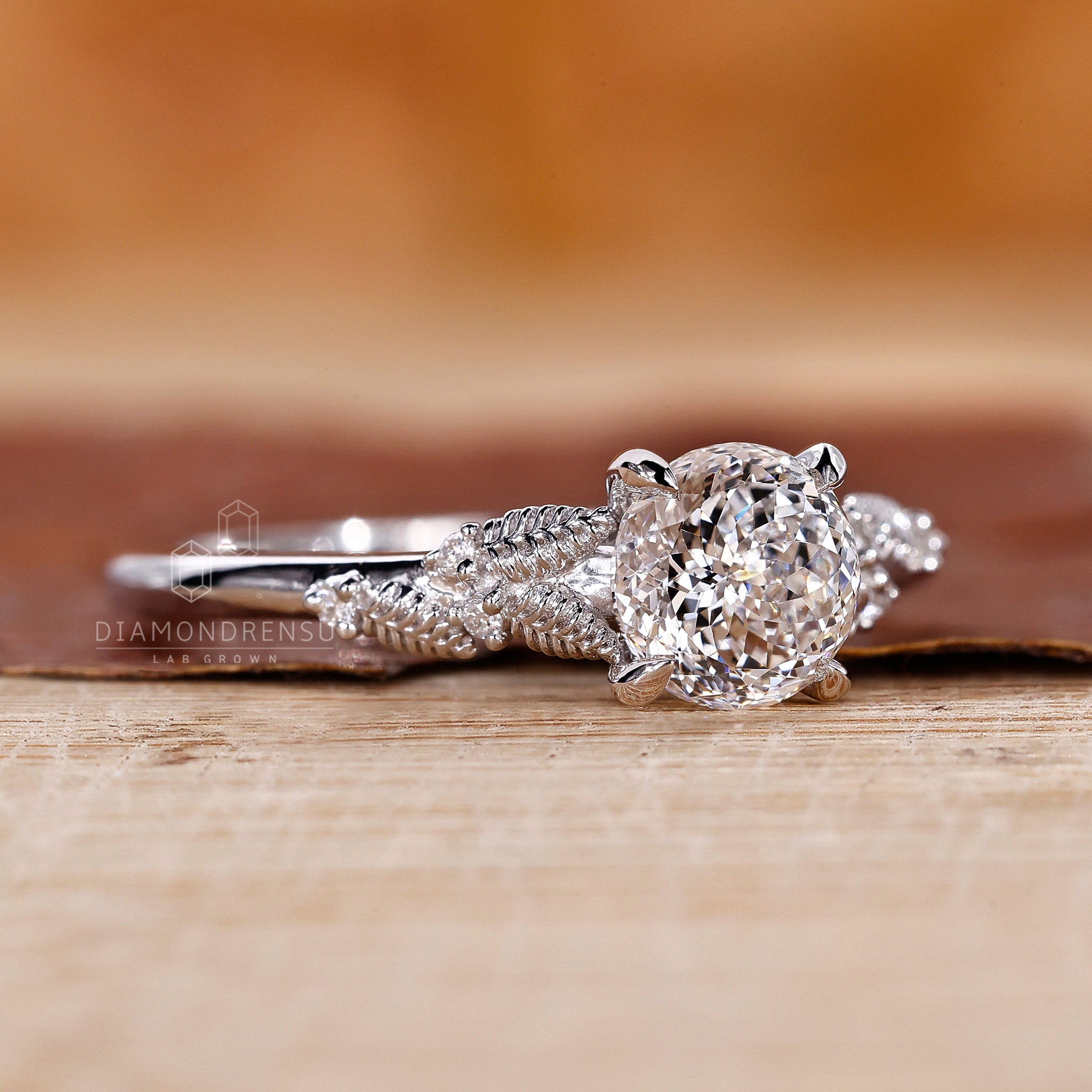 IGI certified lab diamond ring with leaf ascent and four claw prong.

