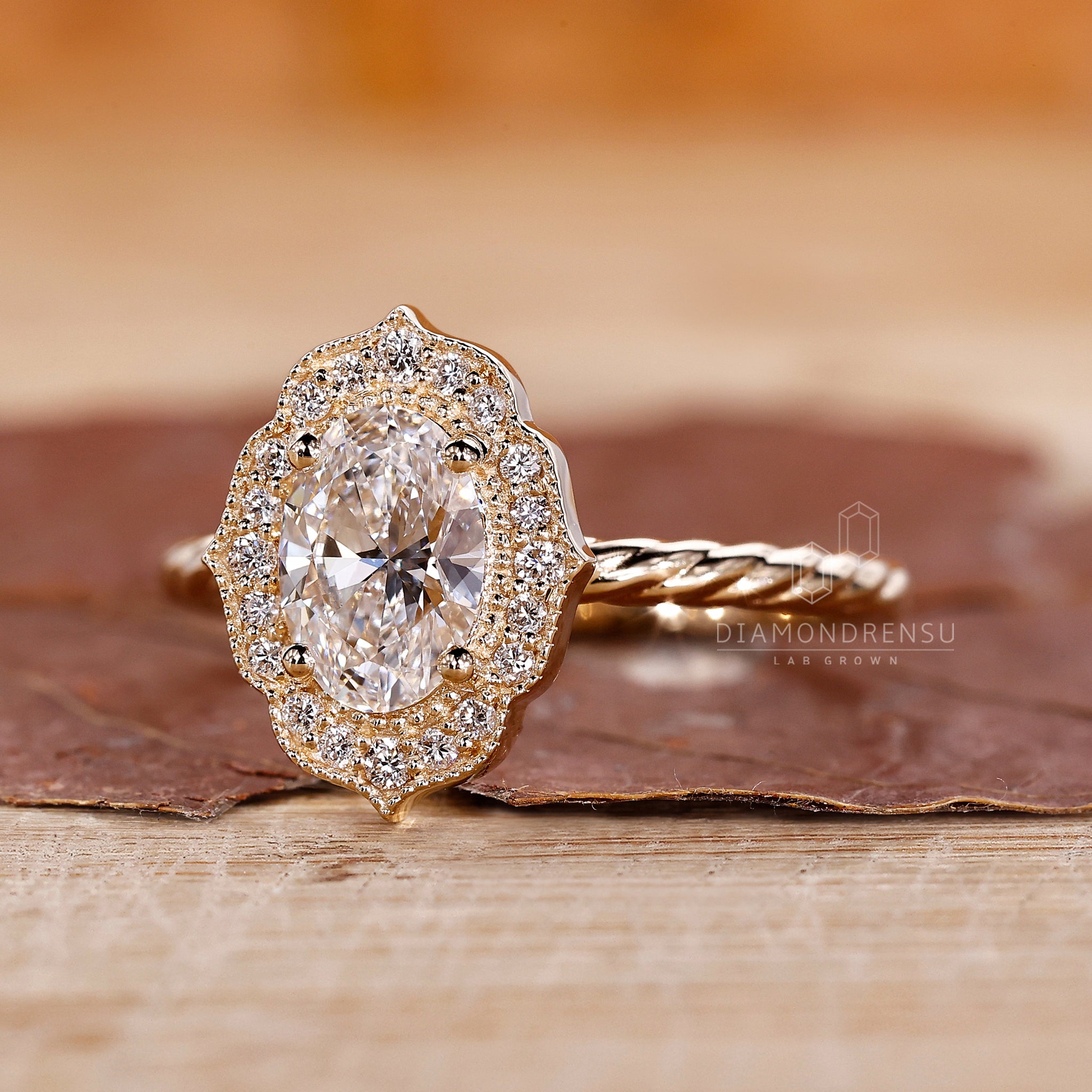 Halo diamond ring highlights the oval center with extra diamonds around it.

