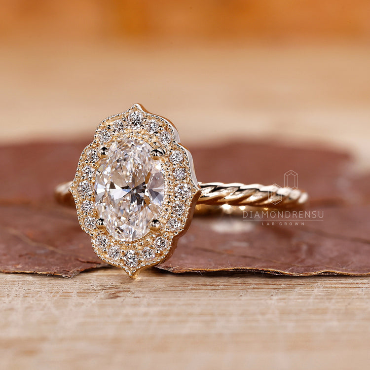 Halo diamond ring highlights the oval center with extra diamonds around it.

