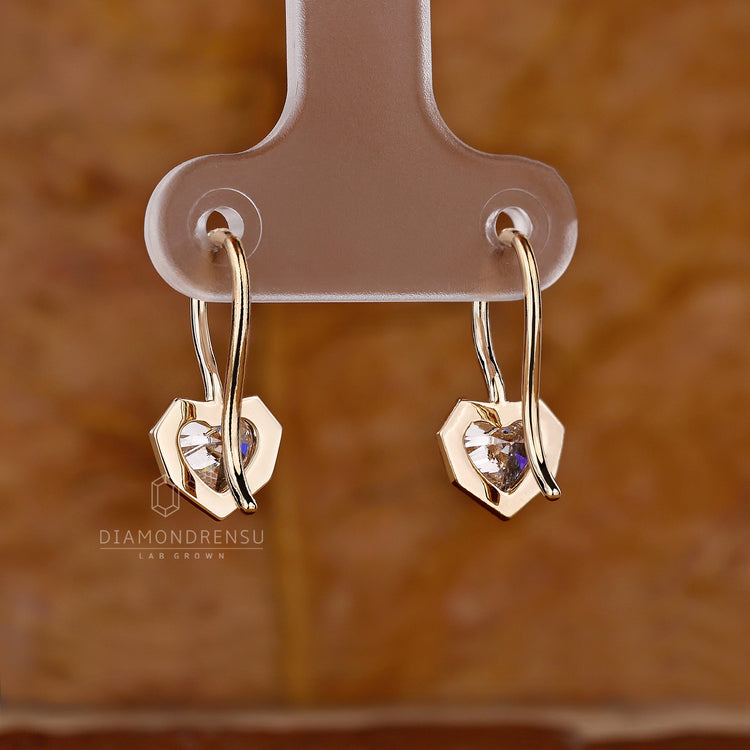 Fish hook heart shape diamond earrings.