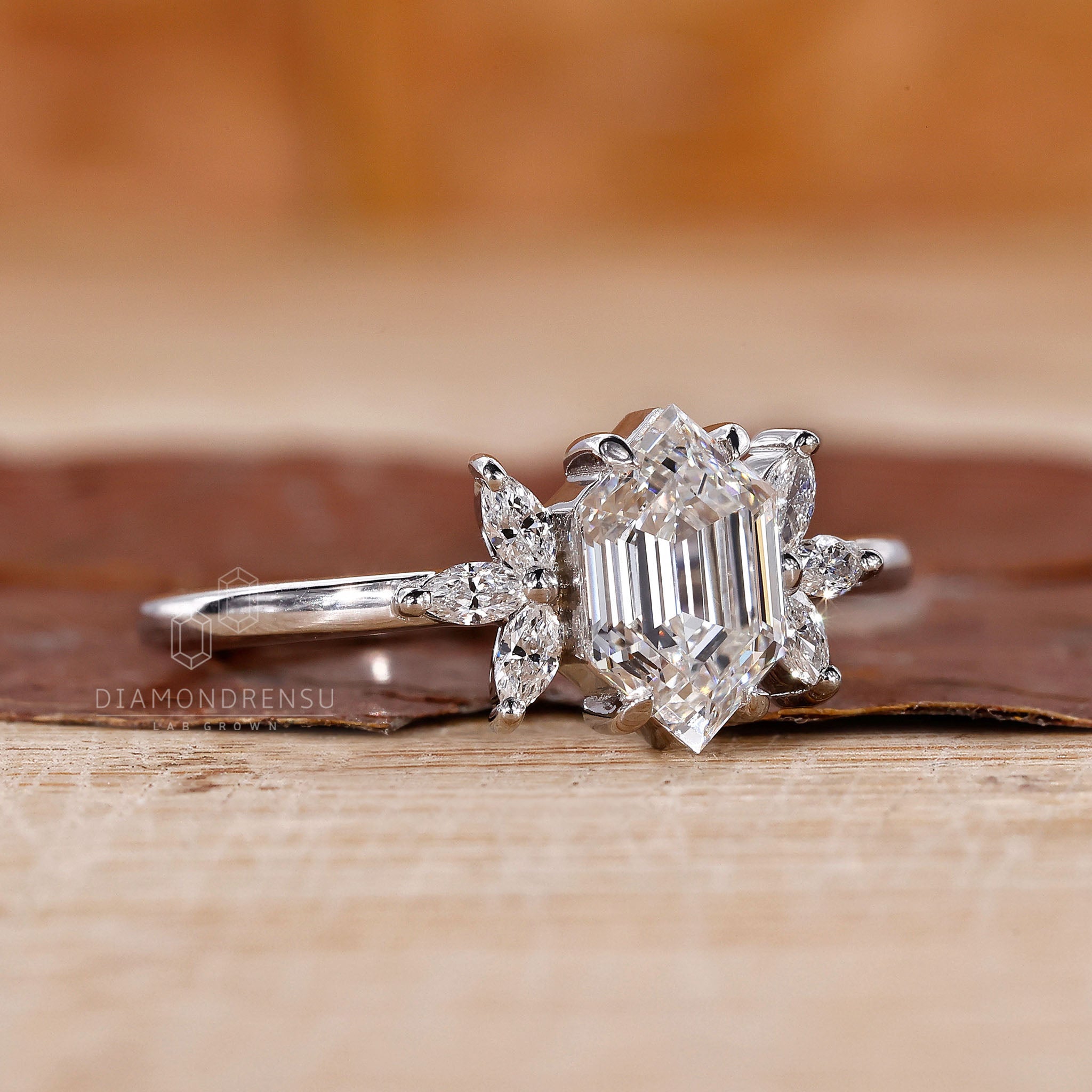 Buy engagement ring featuring marquise diamond side stones.
