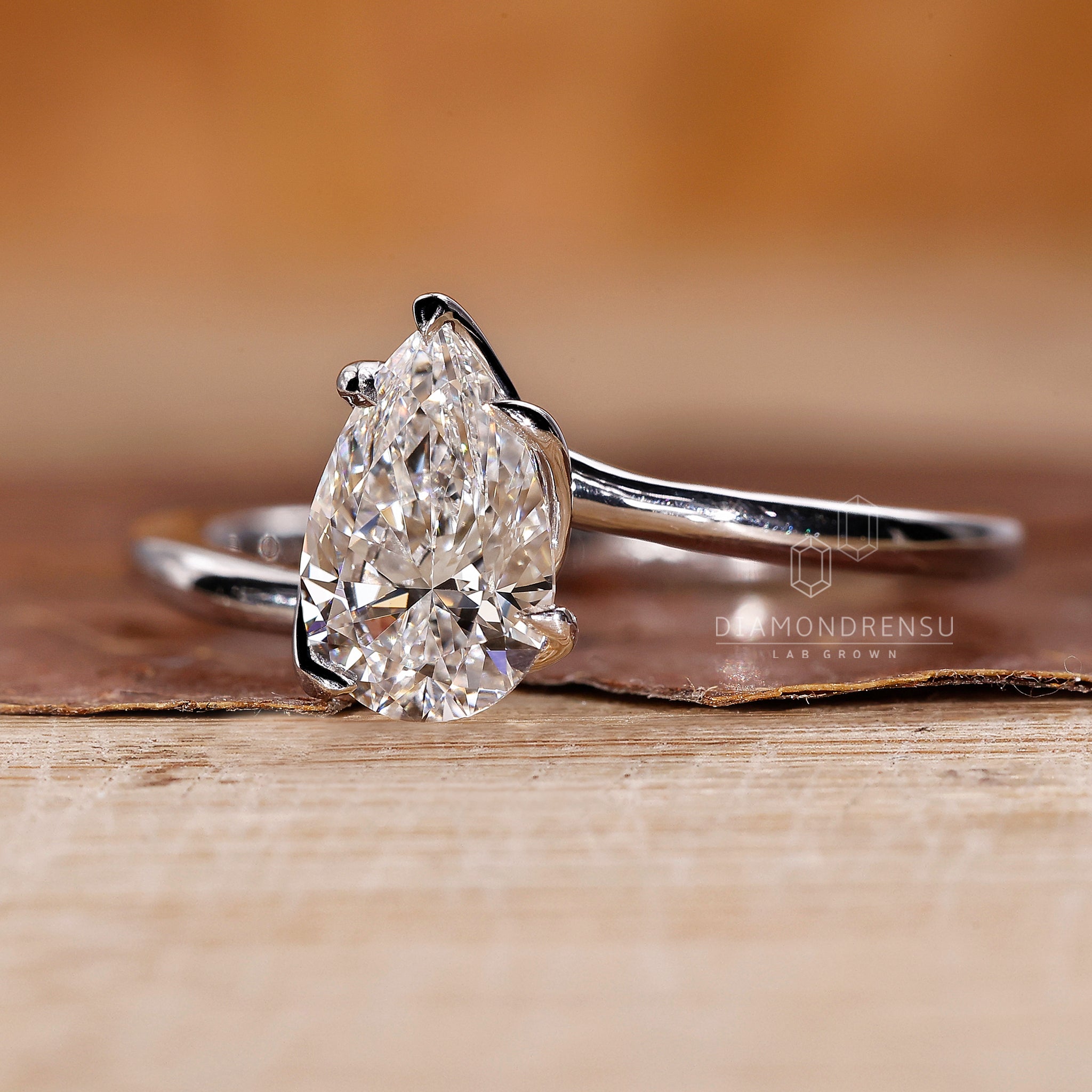 Handmade ring with lab grown pear diamond and prong setting.
