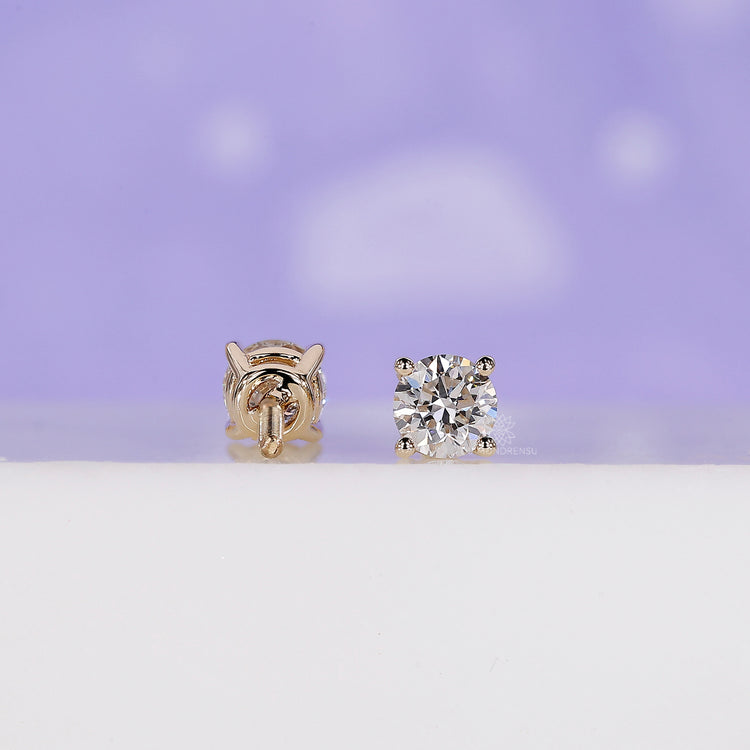 Round diamond earrings with a secure prong setting and handmade finish.