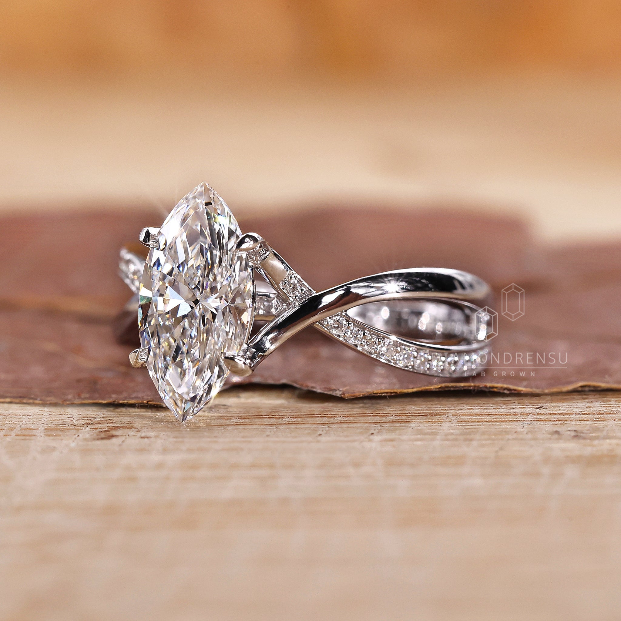 White gold engagement ring with round cut pave and claw prong setting.
