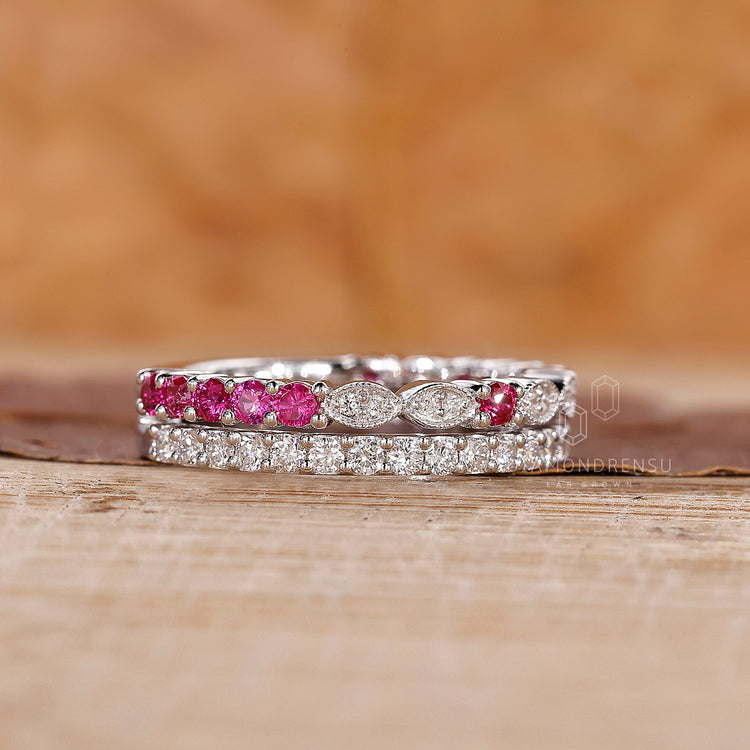 White gold wedding band with round cut rubies and diamonds.