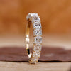 Asscher cut diamond wedding band in yellow gold.
