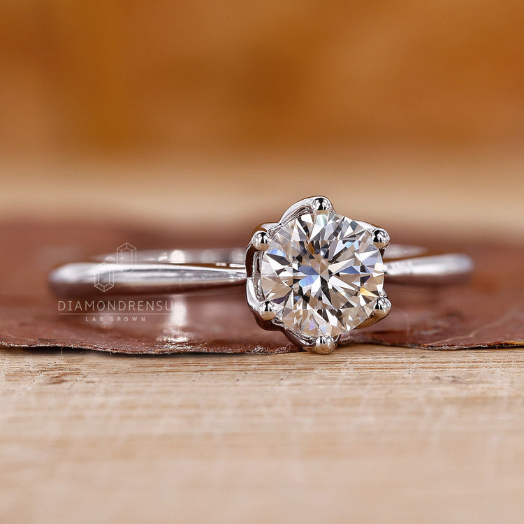 White gold diamond ring with tapered shank and lab grown stone.
