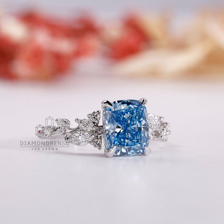 Custom diamond ring with marquise and round accents in white gold.
