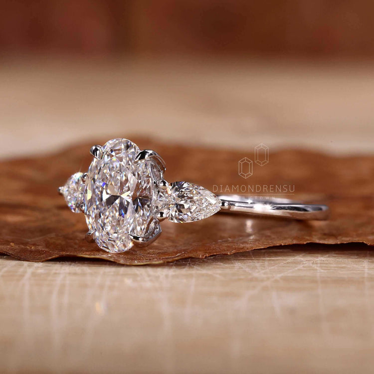 Three stone diamond ring with claw prong setting, crafted for women seeking a timeless and elegant engagement ring.
