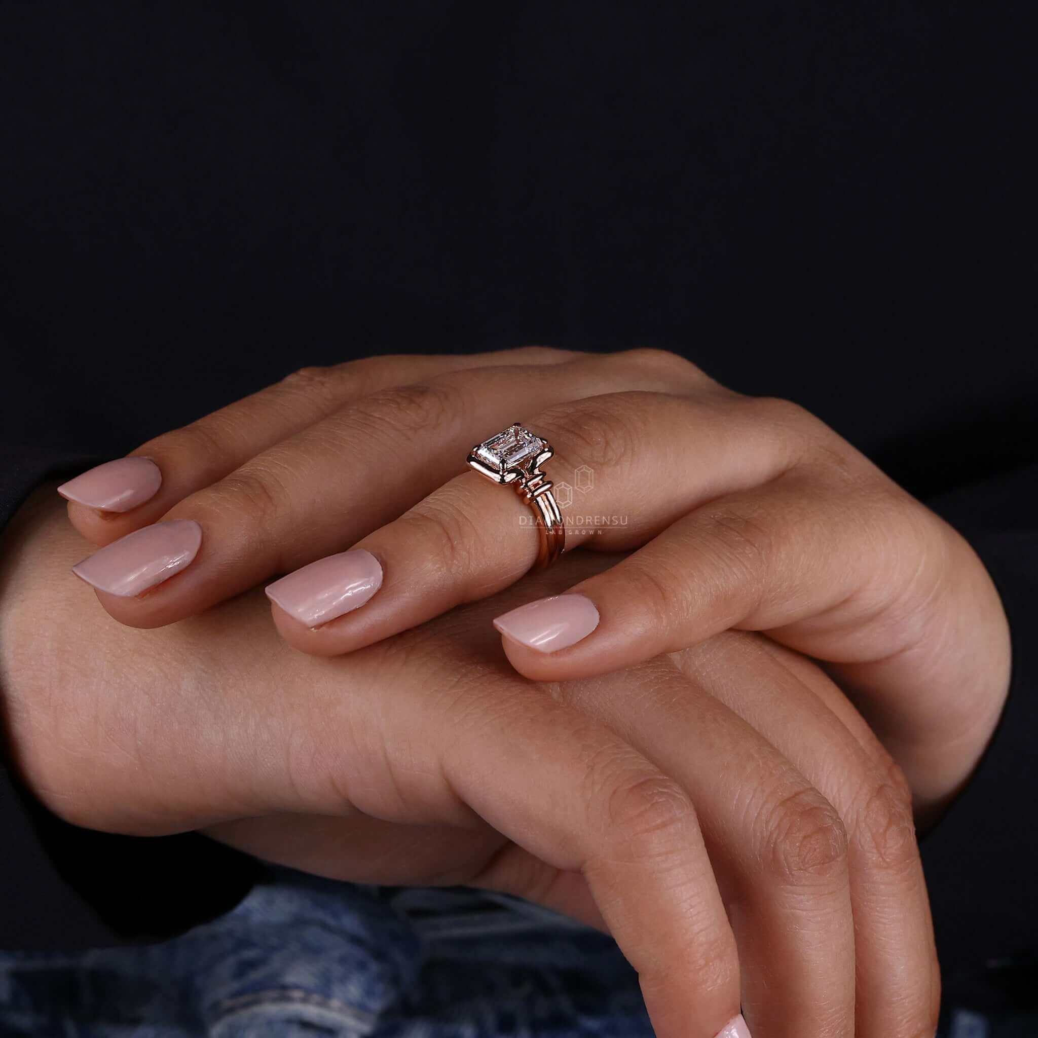 Diamond solitaire ring with an IGI certified emerald cut.