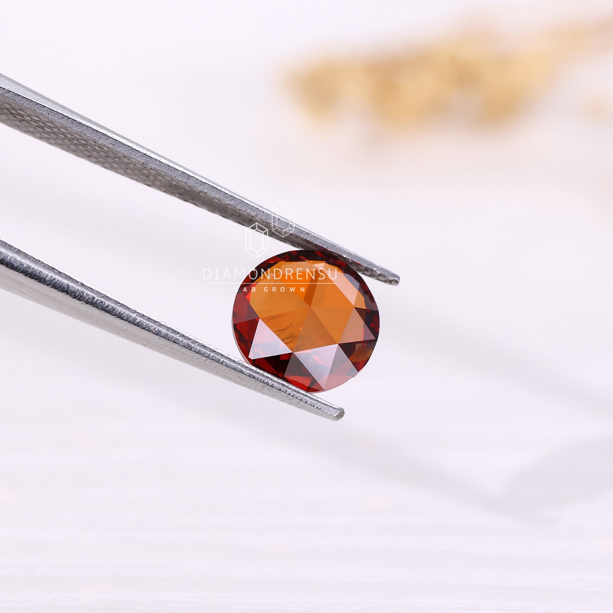 1.38 carat round rose cut diamond in lab grown champagne variety.
