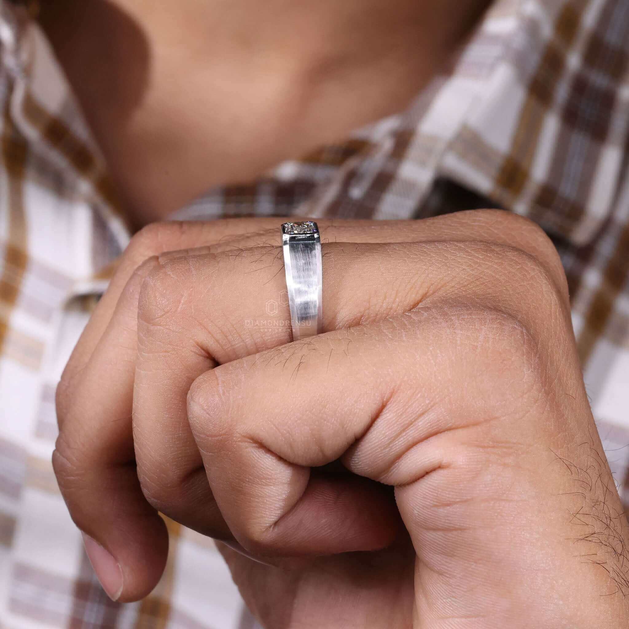 Bezel ring with white gold emerald ring craftsmanship, perfect for men seeking a sophisticated and unique engagement ring.