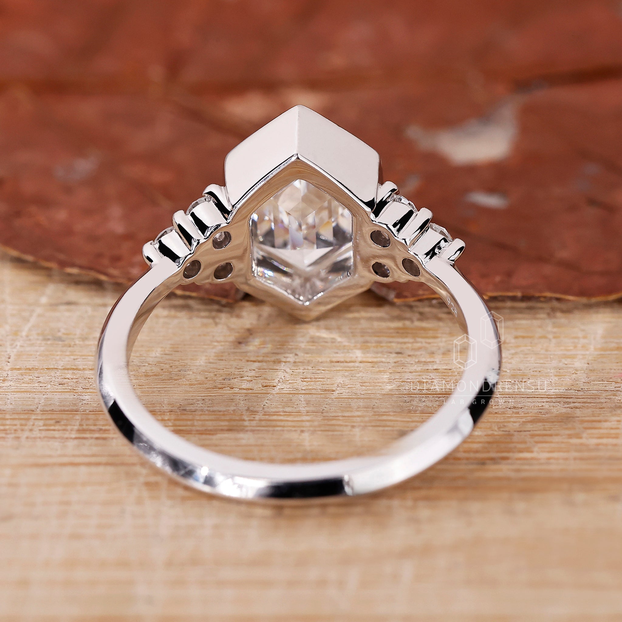 White gold bezel setting ring handmade in the UK.
