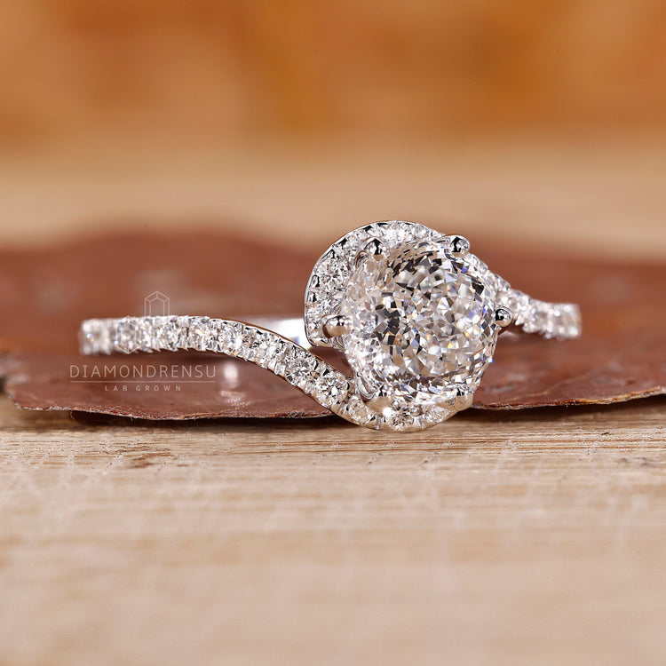 Halo setting surrounds the center diamond with small stones.
