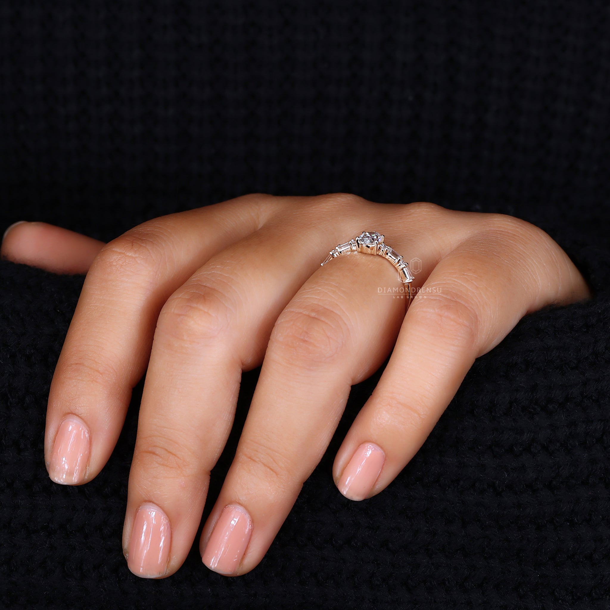 Pave band ring with oval center diamond.
