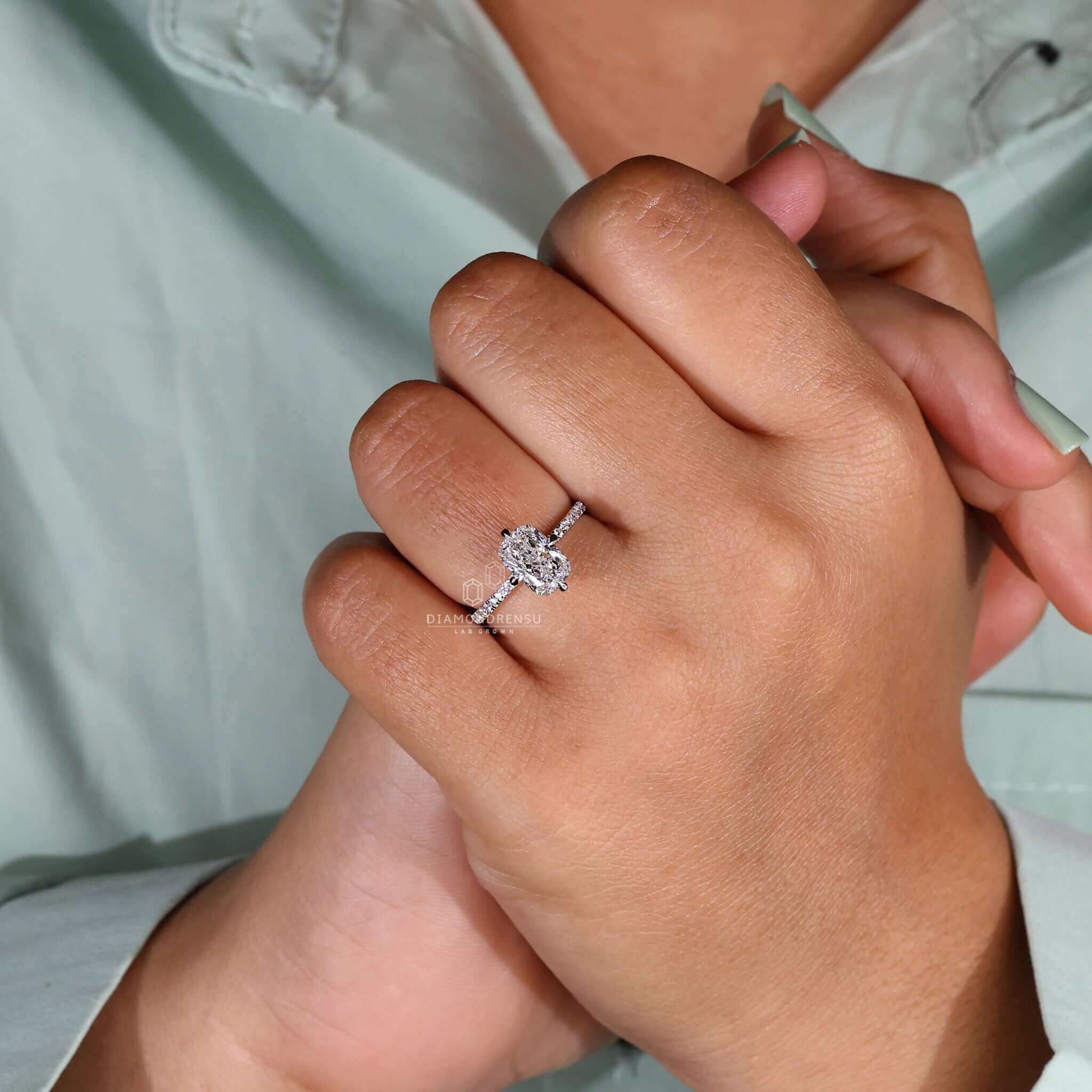 Elegant elongated cushion ring featuring a lab-grown diamond in a pave setting.