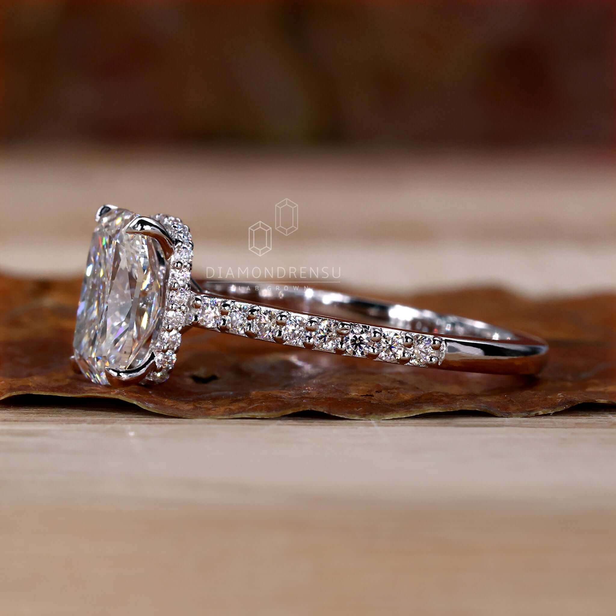 Cushion cut diamond ring crafted with hidden halo engagement ring details.