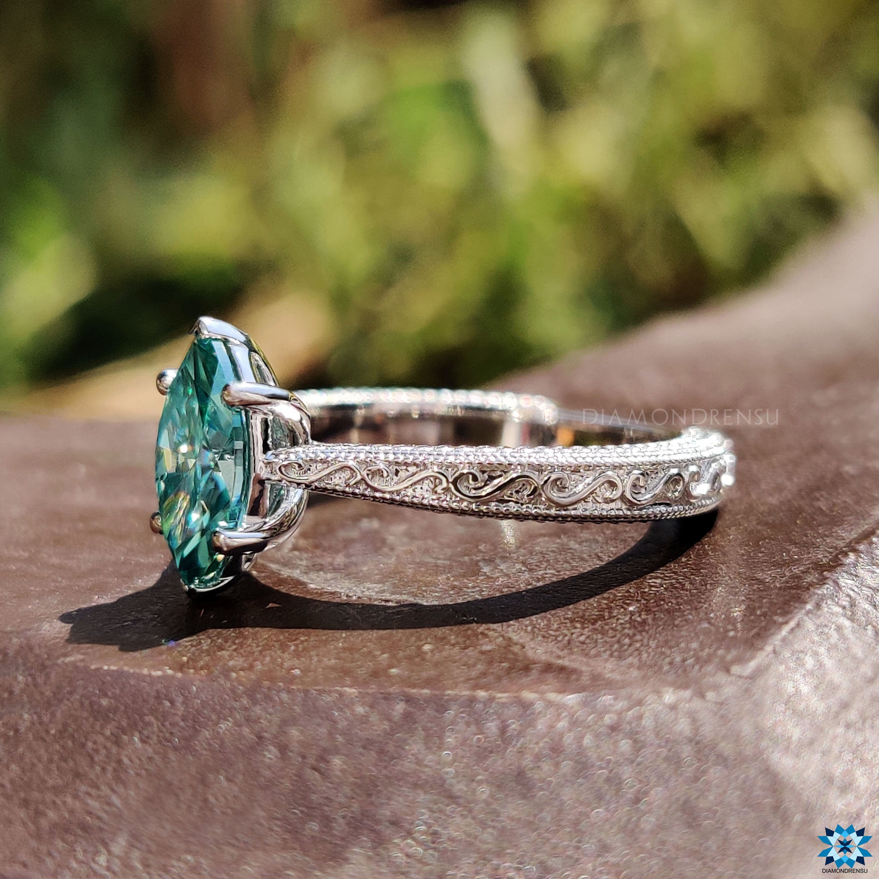 Diamondrensu UK engagement ring with marquise cut moissanite and Art Deco details.
