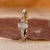 5 stone ring with radiant cut centre and round sides.
