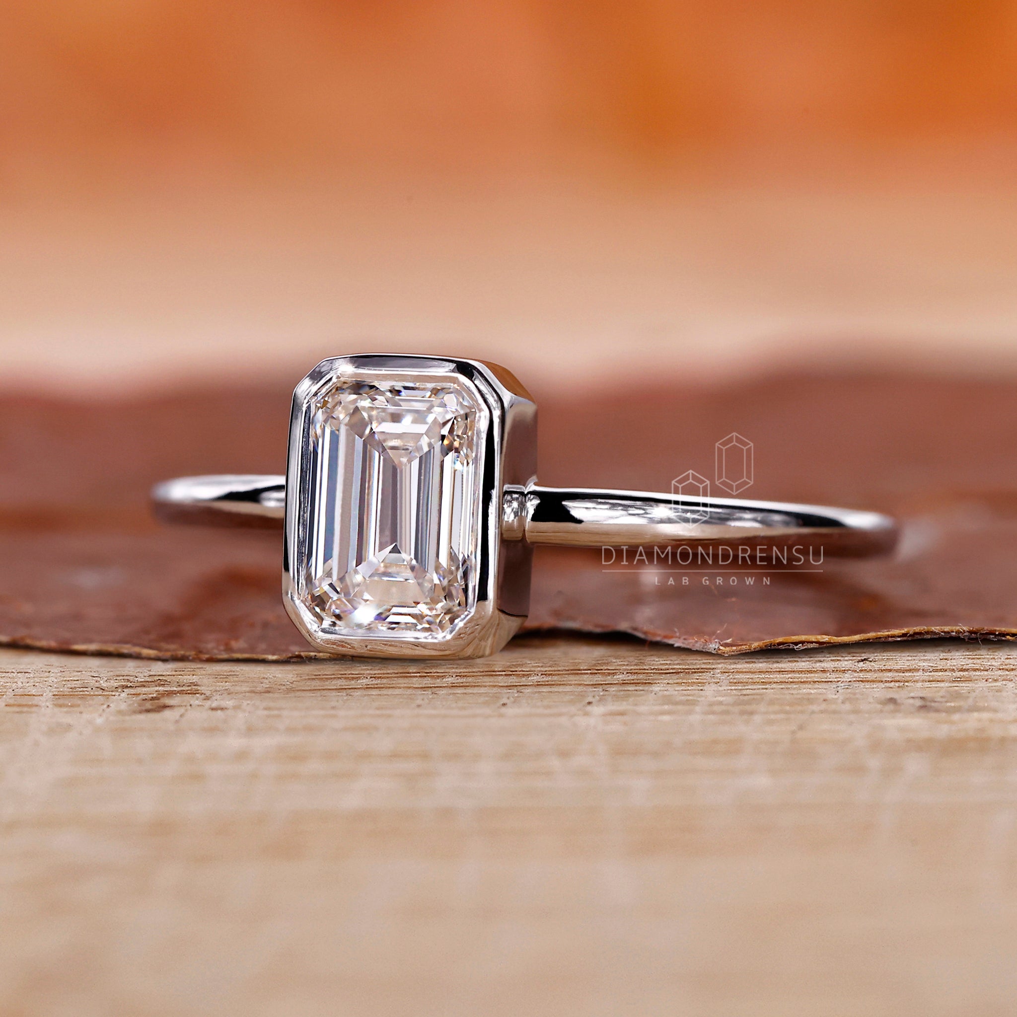 UK engagement ring in a modern bezel setting.
