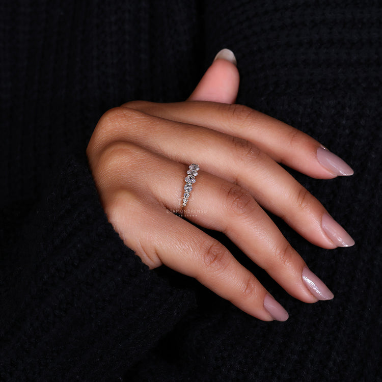 Wedding band with round diamond side stones.
