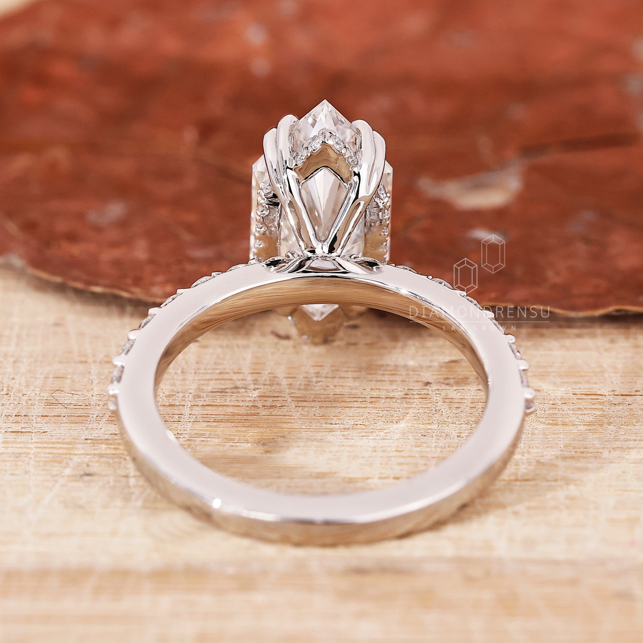 Custom engagement ring with a double claw prong setting.
