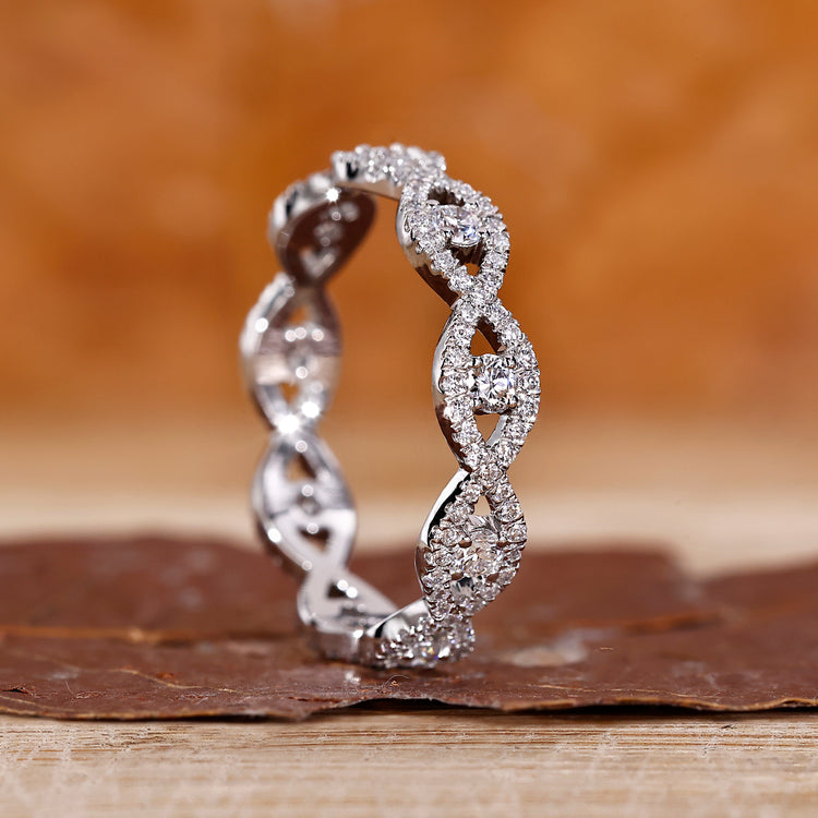 Twisted wedding band with round lab grown diamonds.
