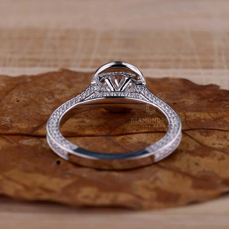 Cathedral setting ring with a halo diamond engagement ring design made for unique style and charm.