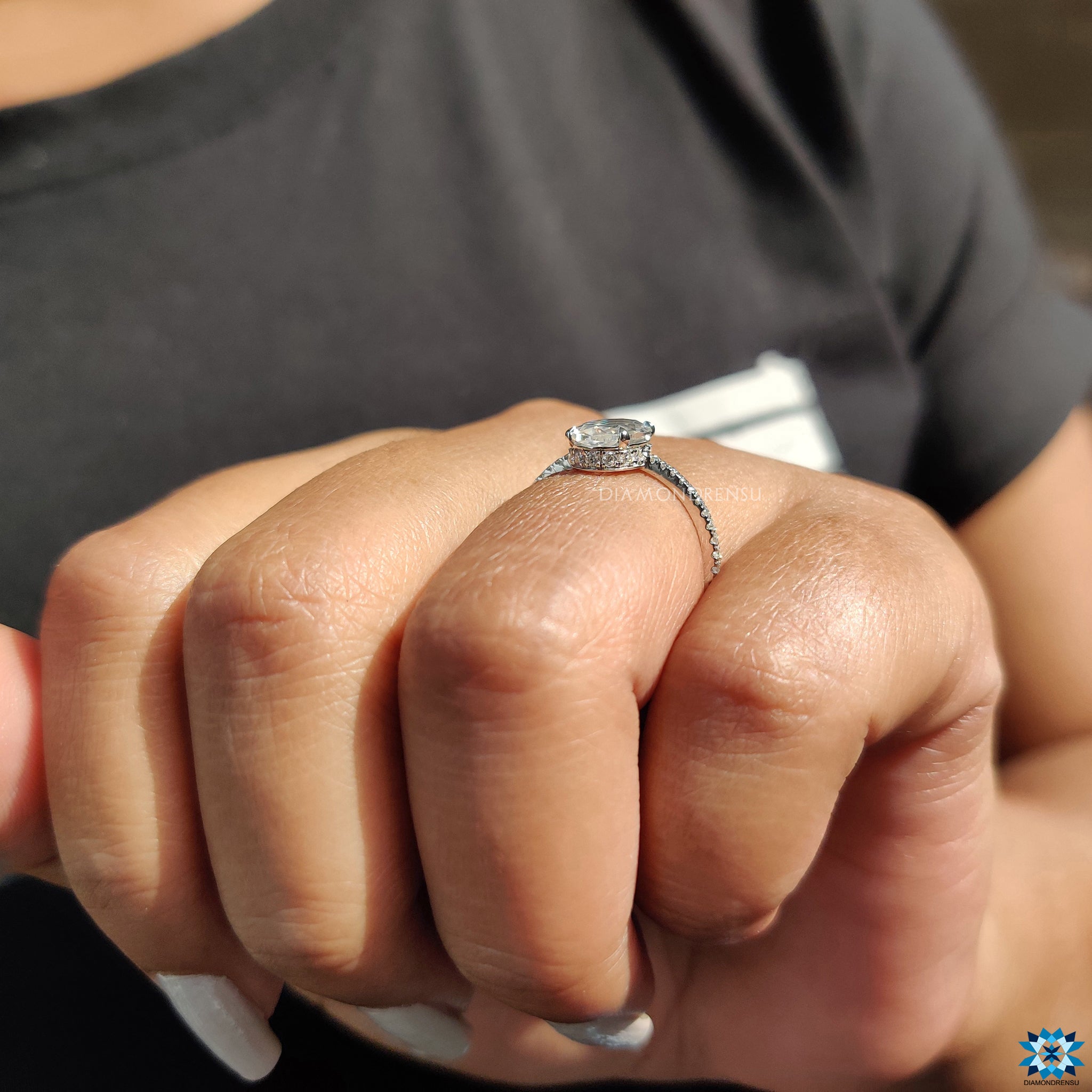 Oval rose cut moissanite ring with round cut pave and claw prong setting.
