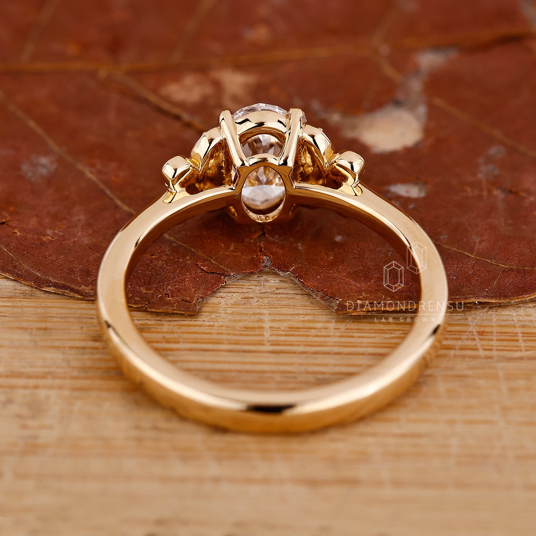 Engage Ring UK features oval design in yellow gold.
