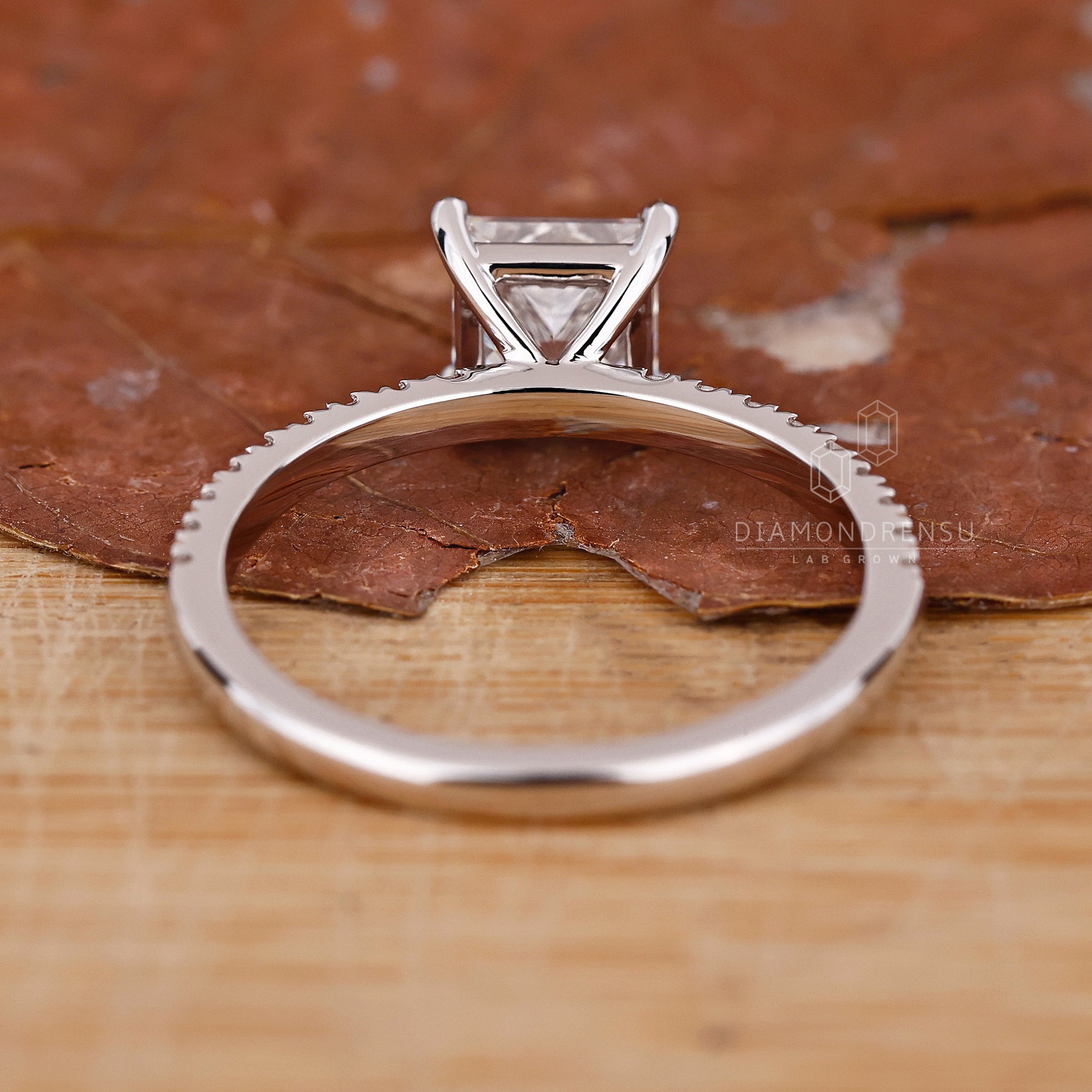 Custom engagement ring with round and princess cut diamonds.
