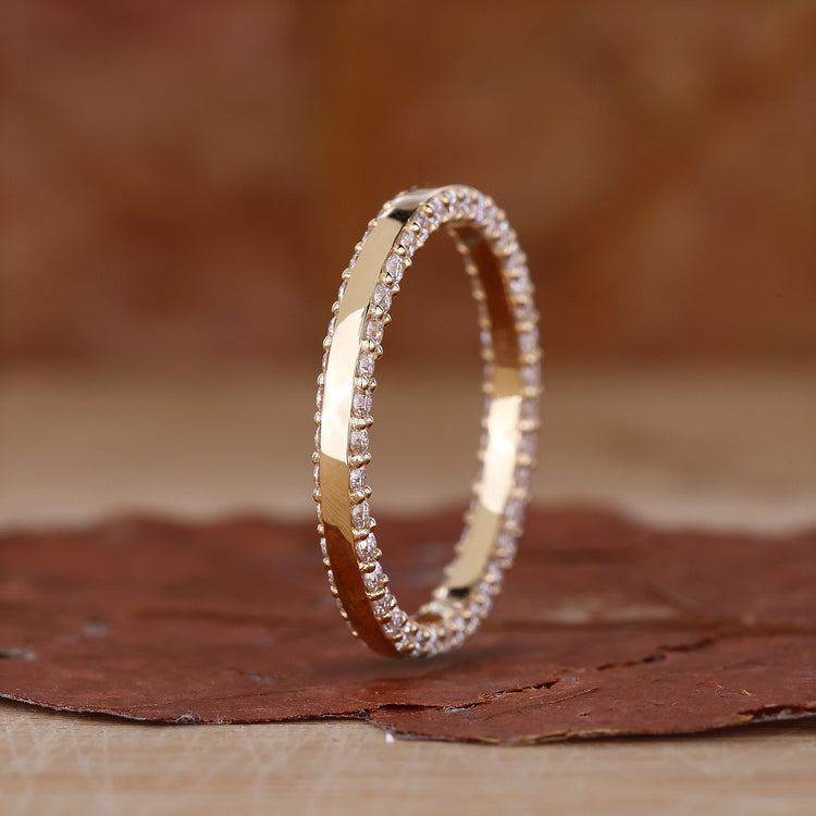 Round cut diamond eternity wedding band.
