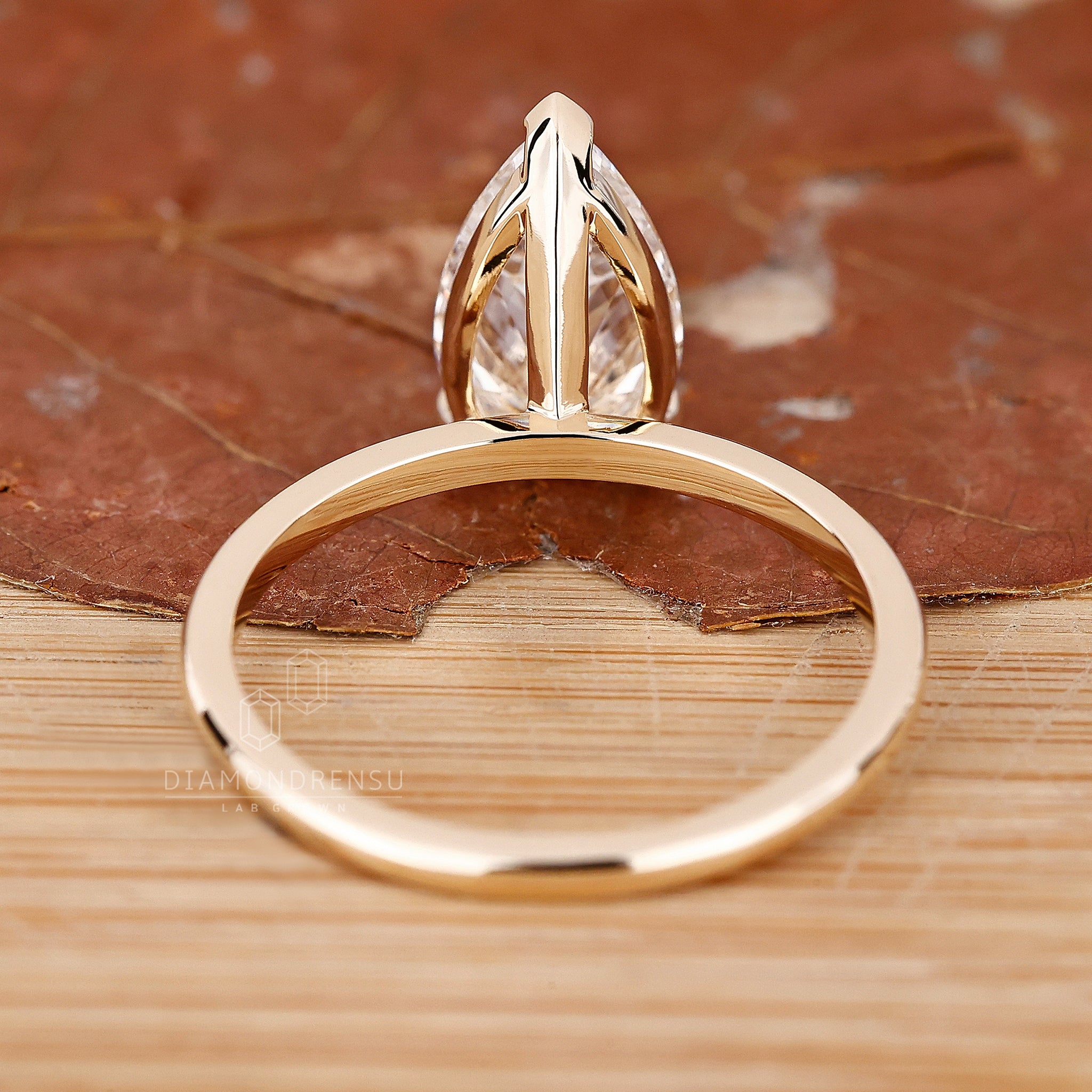 IGI certified pear cut diamond ring with V prong.

