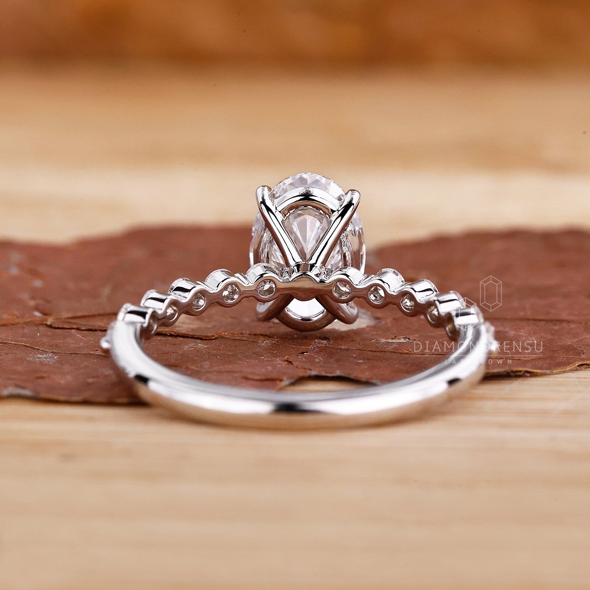 UK engagement ring designed with floating bubble prong.
