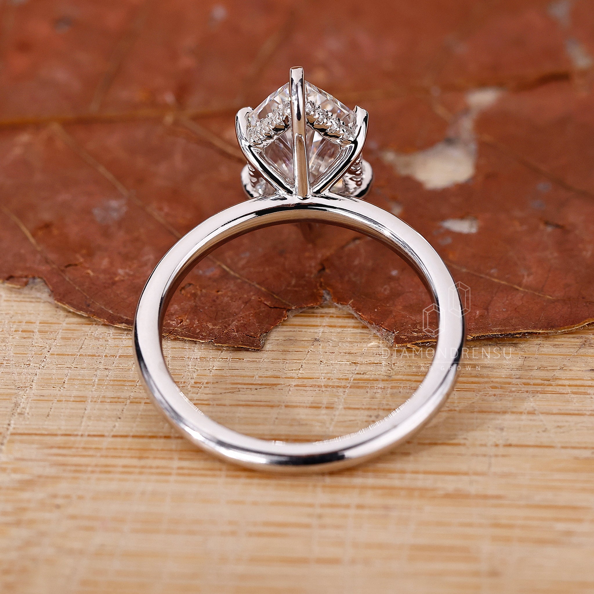 UK engagement ring featuring round cut hidden halo.
