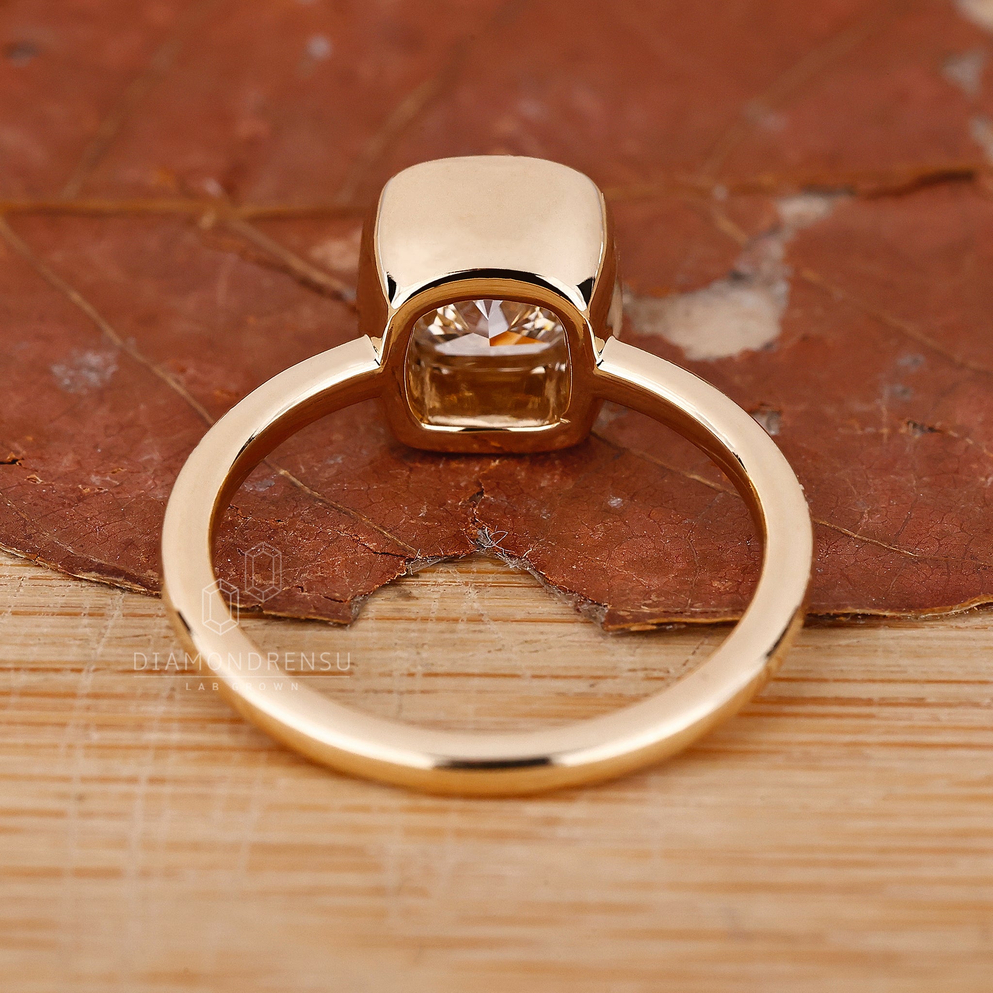 Lab Grown Diamond is used in this cushion cut solitaire engagement ring.
