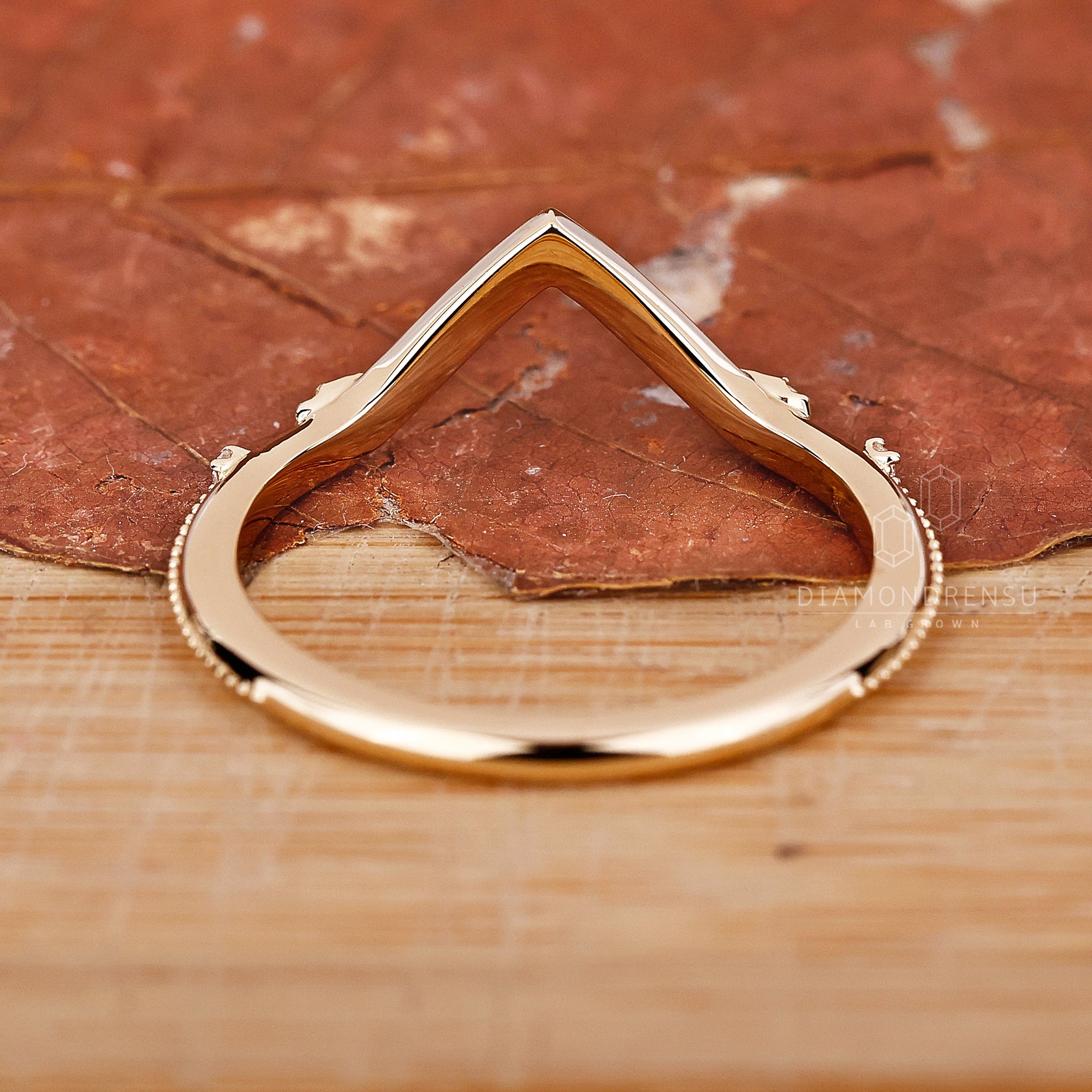 Lab diamond wedding band with V shape.
