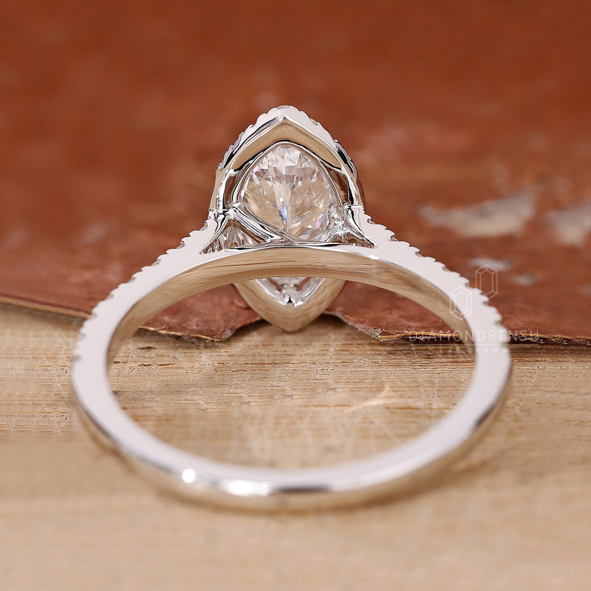 Custom engagement ring with marquise and round cuts.
