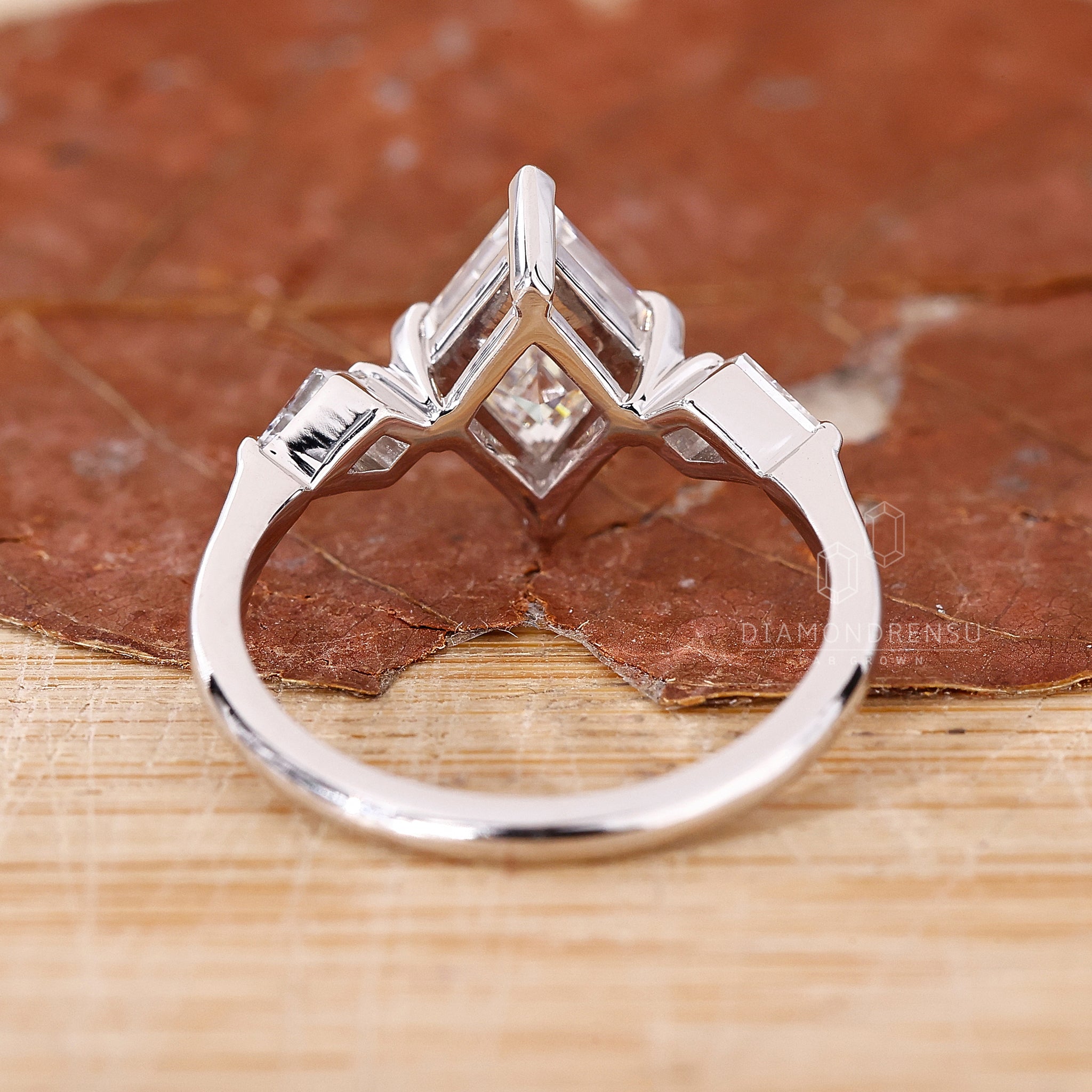 Custom engagement ring with compass prong setting.
