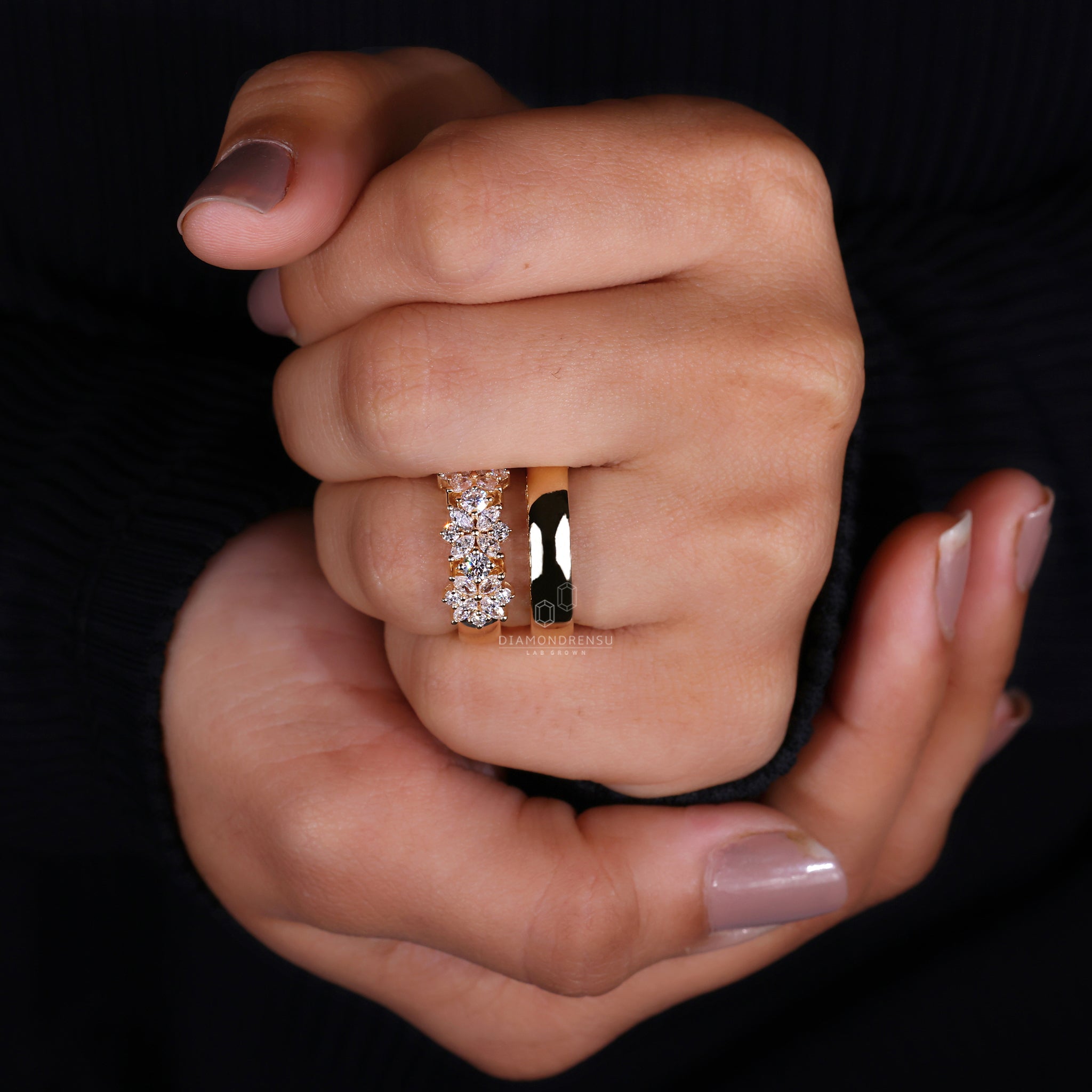 Yellow gold ring featuring marquise and round engagement ring.
