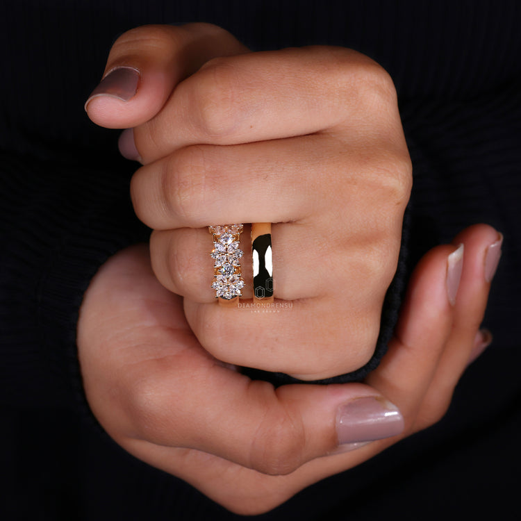 Yellow gold ring featuring marquise and round engagement ring.
