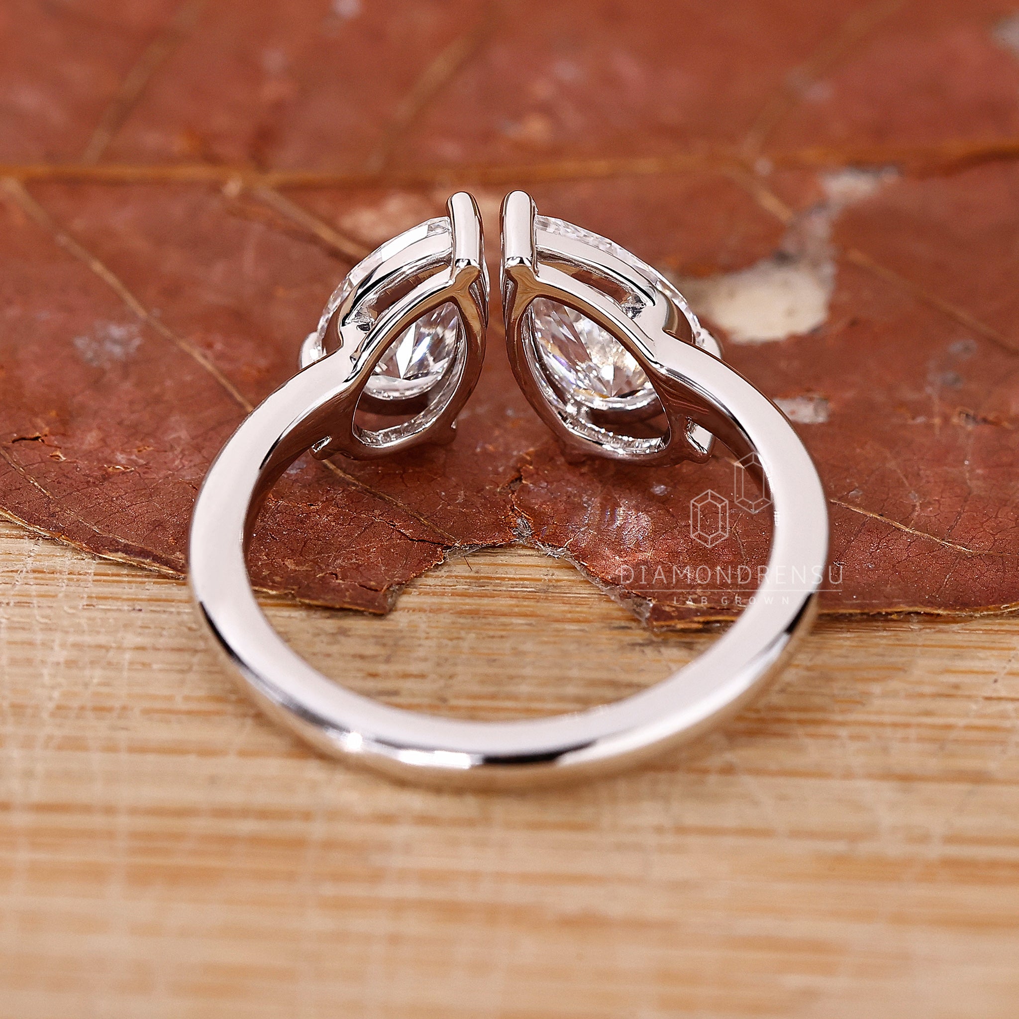 White gold ring with two diamond center stones in Toi et Moi style.
