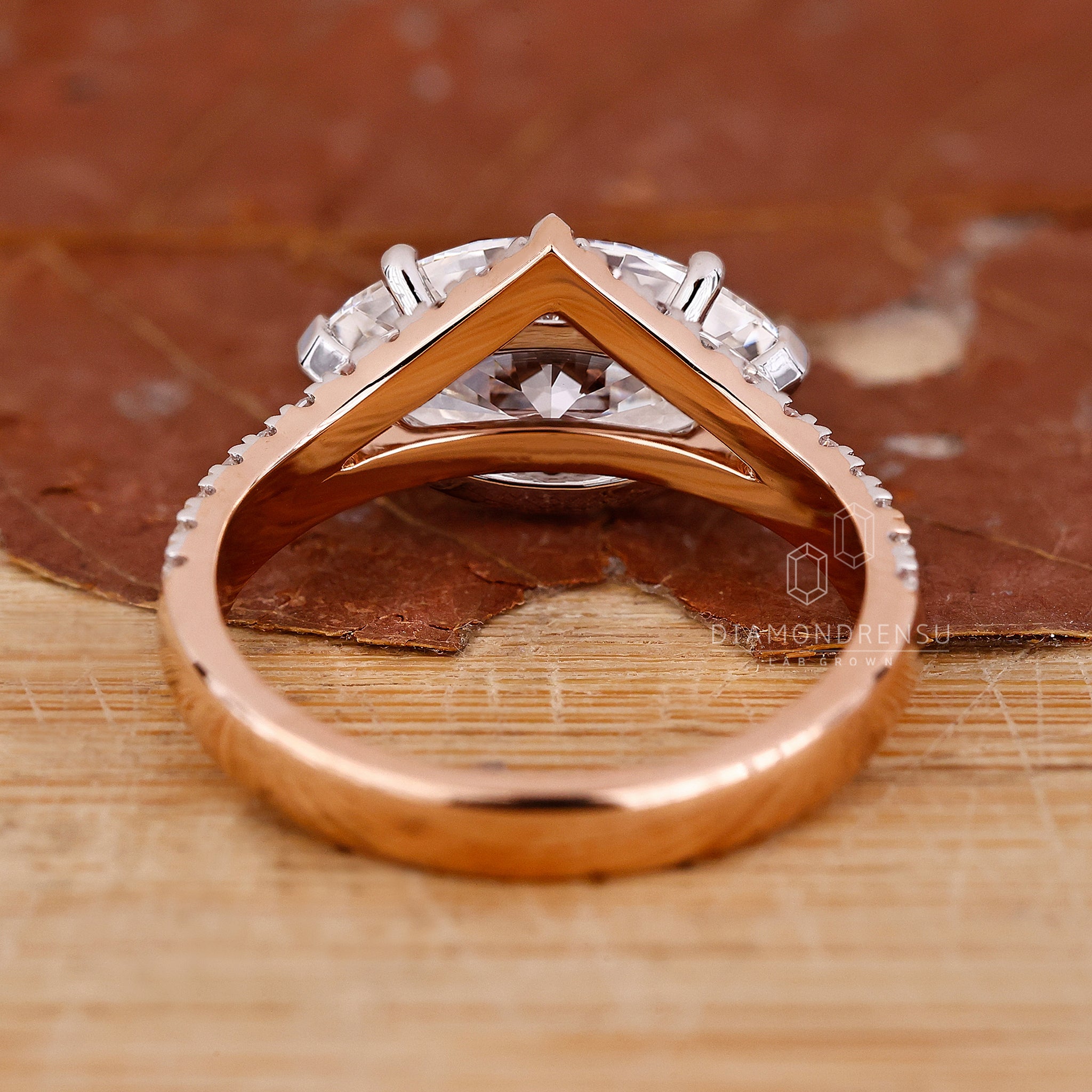 Lab grown diamond ring with dual shank and white and rose gold design.
