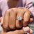 Distance pave ring featuring radiant moissanite and round cut pave band.
