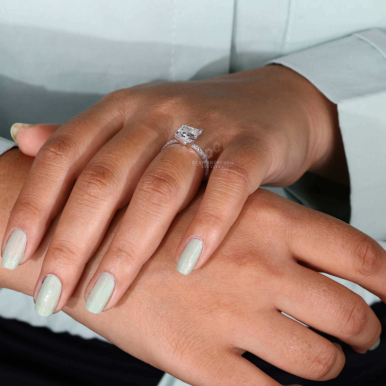 Engagement ring with pave accents designed to captivate hearts.