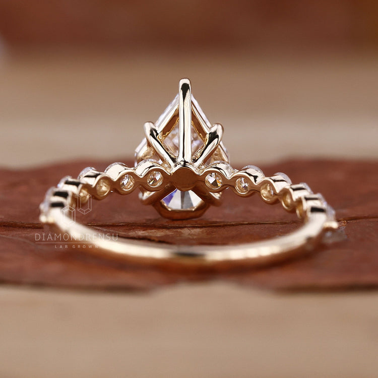 Shared prong engagement ring in elegant yellow gold.