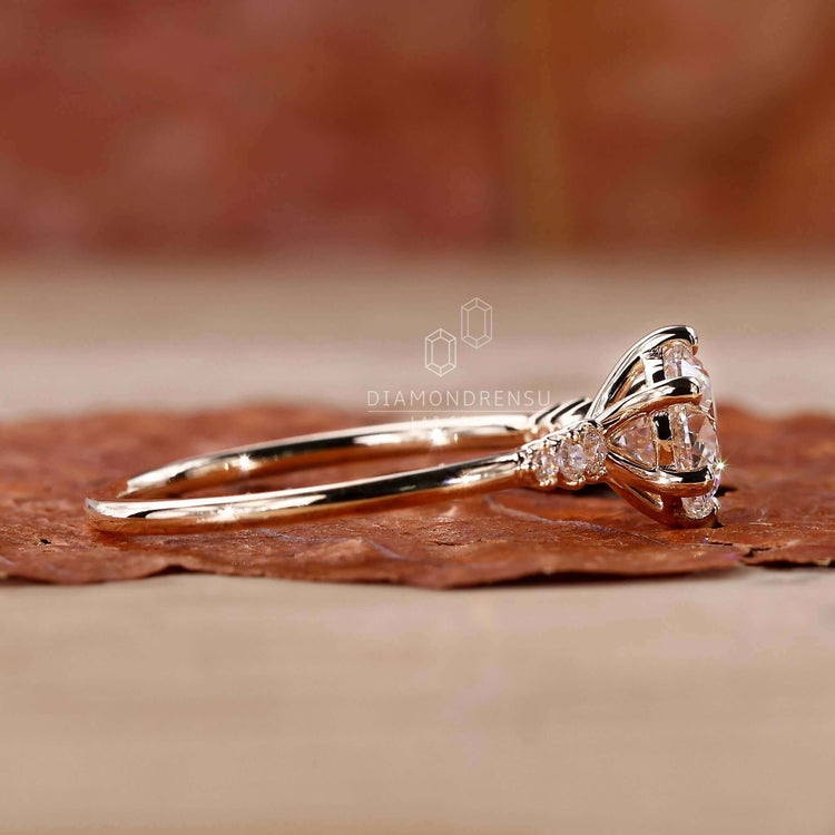 Beautiful round engagement ring with side stones for a timeless look.